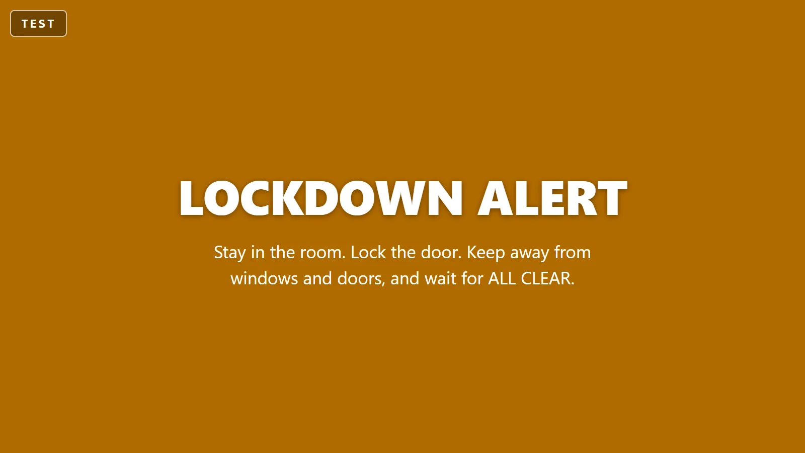 A wall display in amber reading LOCKDOWN ALERT with a TEST badge in the corner.